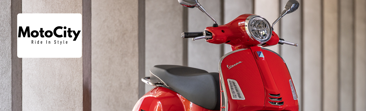 Scooter inventory lined up outside MotoCity Vespa Naples in Collier County